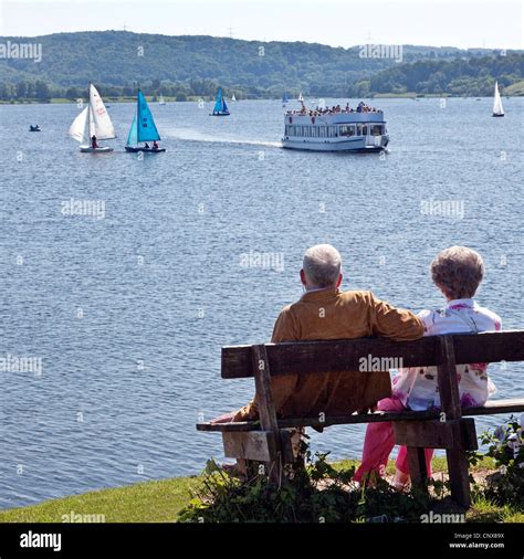 Old Couple Sitting On A Bench At Lake Kemnade Hi Res Stock Photography