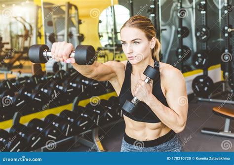 Working Out With Dumbbell Weights At The Gym Fitness Women Exercising