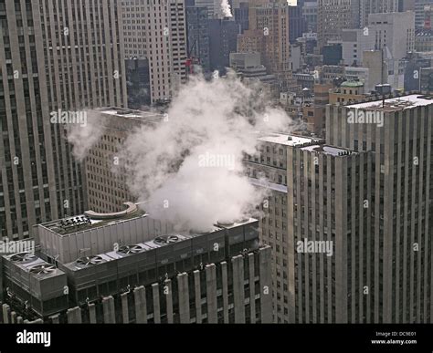 Smoke Rising From The Heating Unit Of A Skyscraper In Midtown Manhattan