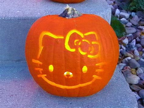 Two Pumpkins That Have Been Carved To Look Like Hello Kitty