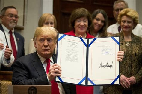 Trump Signs New Laws Aimed At Drug Costs And Battles Democrats On