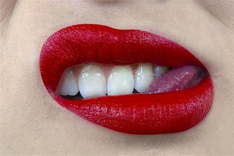 Sensual And Mouth With Red Lipstick White Teeth Biting Tongue Pose