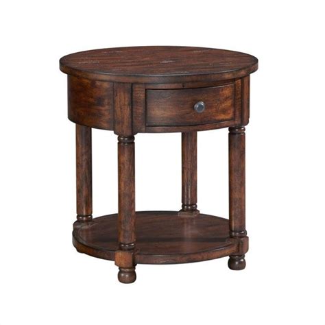 This charming little side table is a wonderful option for a small storage space that can sit handsomely. Broyhill Attic Heirlooms Round End Table in Rustic Oak - 3399-012