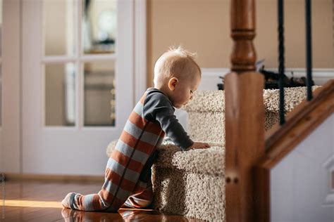 Baby About To Climb The Stairs By Stocksy Contributor Kelly Knox