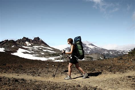 A Woman Hiking Along A Trail Photograph By Jordan Siemens Fine Art
