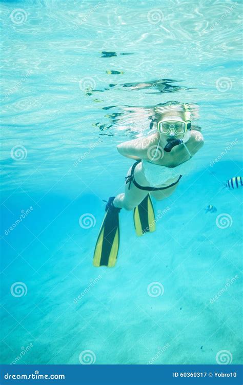 Underwater Portrait Of A Woman Snorkeling In Clear Tropical Sea Stock