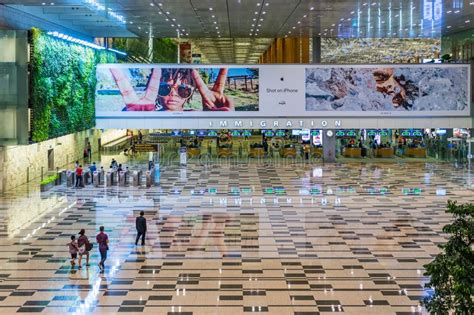 Visitors Walk Around Departure Hall In Changi Airport Singapore