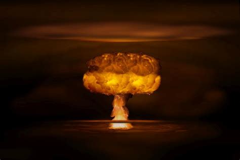 Atomic Bomb Realistic Explosion Orange Color With Smoke On Black