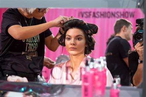 Kendall Jenner Looks At Her Flawless Skin As She Gets Her Hair Tucked