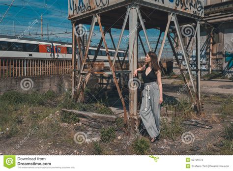 beautiful brunette posing in an industrial context stock image image of caucasian female