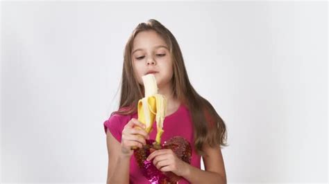 Girl Dances With A Banana A Girl Peels A Banana And Eats A Banana Happy Emotions Of A Hungry
