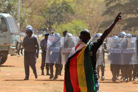 Police In Zimbabwe Hit Protesters With Batons Tear Gas And Water Cannons The New York Times