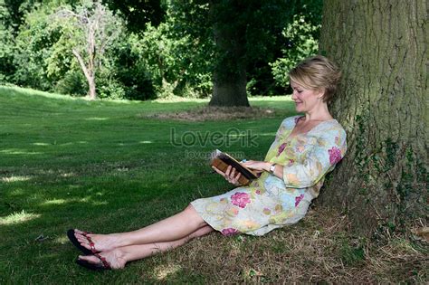 Woman Leaning On The Tree Reading A Book Picture And Hd Photos Free