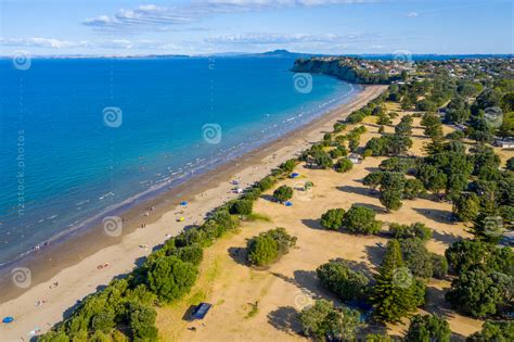 Aerial View Of Long Bay Beach Park In Auckland Nz Stock Photos