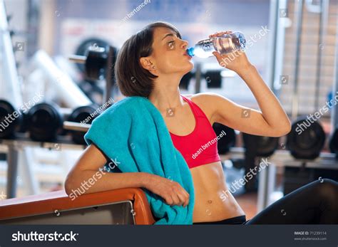 Woman In Gym Drinks From Water Bottle Stock Photo 71239114