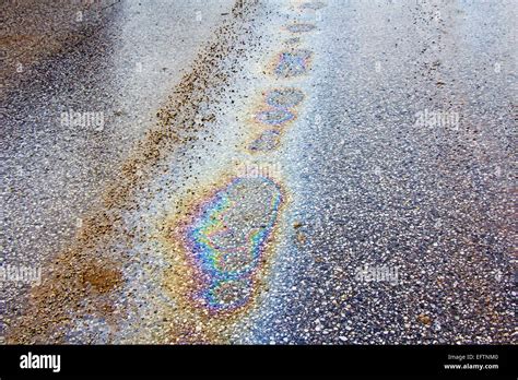 Oil Spill On Asphalt Road As Texture Or Background Stock Photo Alamy