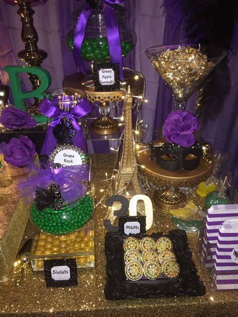 birthday masquerade party candy buffet in purple green black and gold mardi gras desserts