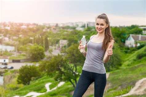 Thirsty Fitness Girl Holding Bottle Of Water Stock Image Image Of