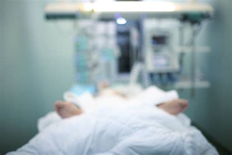 Critically Ill Patient In Icu Ward Blurred Medical Background Stock