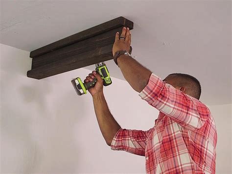 You need to stay under the maximum weight limits of both the storage ans: How to Install Ceiling Storage in a Garage | HGTV