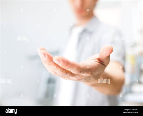 Man Holding Something On His Hand Stock Photo Alamy