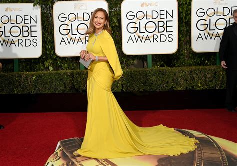 Jennifer Lopez Shines Brightly In Marigold Drips In
