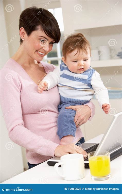 Woman With Baby Working From Home Stock Photos Image 19060523