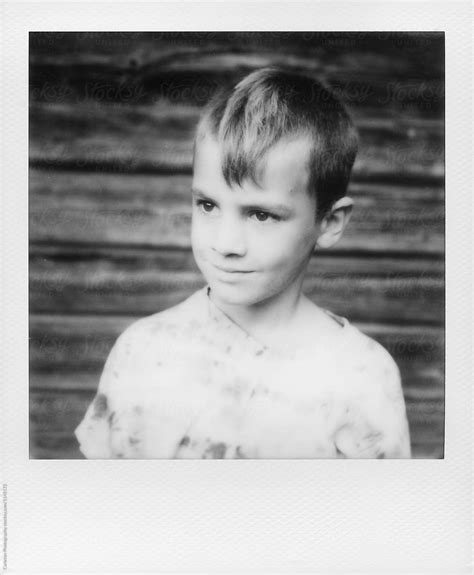 Black And White Polaroid Photo Of Seven Year Old Boy By Stocksy