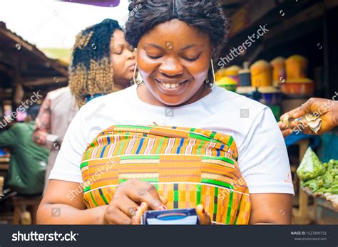 Young African Market Women Holding Pos Stock Photo 1527809732