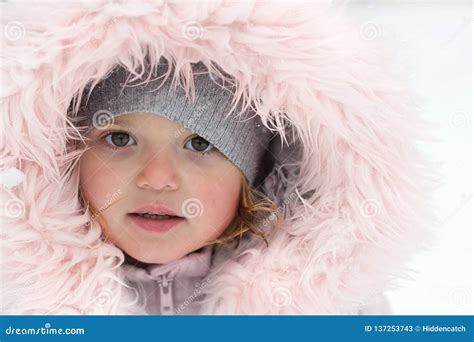 Winter Portrait Of A Beautiful Little Girl On A Snowy Day Stock Image