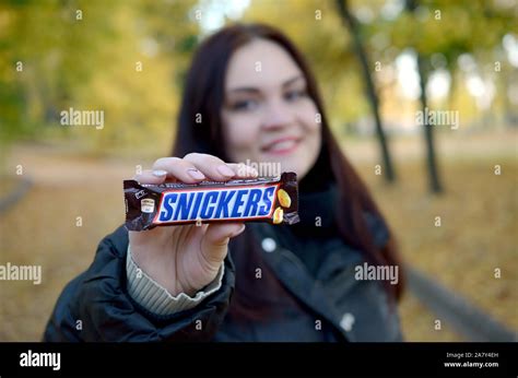 Kharkov Ukraine October 8 2019 A Young Caucasian Brunette Girl Shows Snickers Chocolate Bar