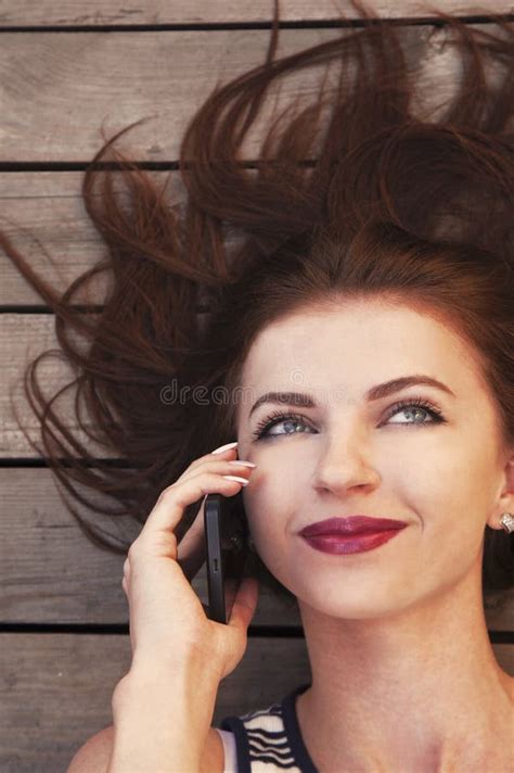 Beautiful Young Happy Woman Smiling During A Phone Call Stock Image