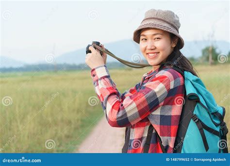 Asian Tourist Woman Taking Photo By Digital Camera On Nature Mountain