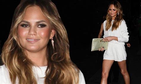 Chrissy Teigen Puts On A Leggy Display In A Mini Dress While Leaving