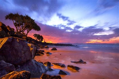 Image Of Incredible Colourful Sunset At Byron Bay Over The Water