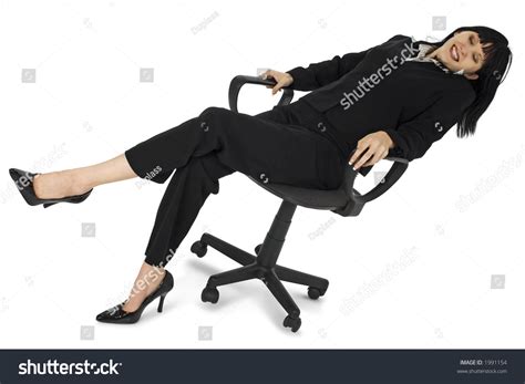 Young Woman In Office Chair Leaning Back Stock Photo 1991154
