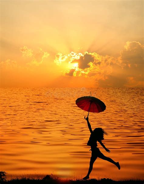 Umbrella Woman And Sunset Silhouettewater Reflect Stock Image Image