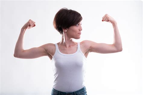 Fit Young Woman Flexing Her Arms Showing Her Biceps Stock Photo Image