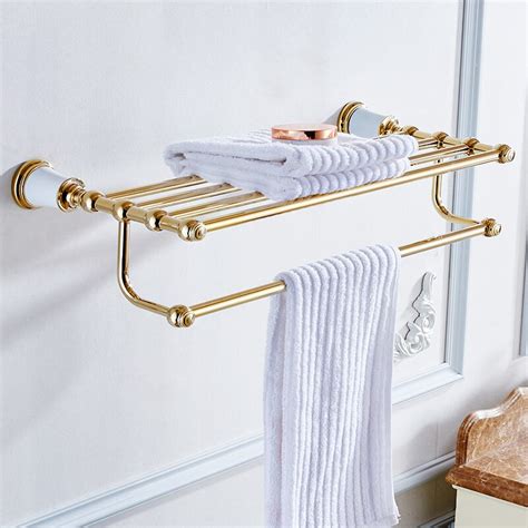 What type of hotel towel rack that is used in the bathroom? VidricShelves Golden Brass Material Wall Mounted Bath ...