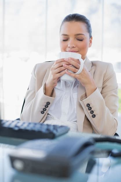 Premium Photo Peaceful Sophisticated Businesswoman Smelling Coffee