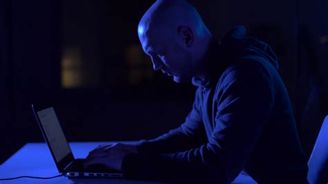Cybercrime Hacking And Technology Crime Male Hacker In Dark Room Writing Code Or Using