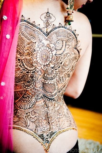 You can have your henna tattoo start at the lower part of your leg, and then it can extend to your foot. Best Henna Tattoos for Back: Bold and Beautiful Designs ...