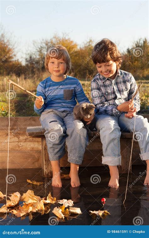 Happy Boys Go Fishing On The River Two Children Of The Fisher W Stock