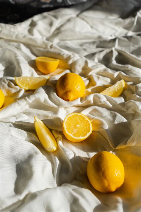 Yellow Citrus Fruit On White Textile Photo Free Citrus Fruit Image On