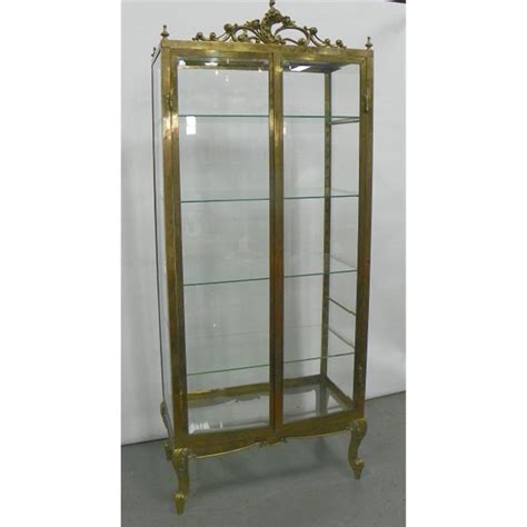 Curio cases and display cabinets. Mid century brass & glass curio/display cabinet