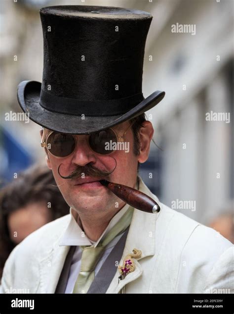 British Dandy Chap In Top Hat Smoking Cigar At The Grand Flaneur