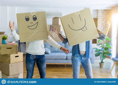 Funny Couple Wearing Cardboard Boxes With Fun Crazy Emoji Faces Over