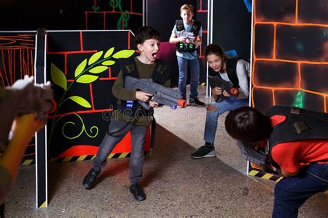 Kids Playing Laser Tag On Labyrinth Stock Photo Image Of Lasergame