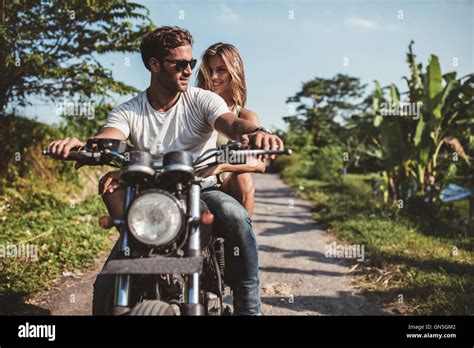 Shot Of Young Couple On Motorcycle Man Riding On A Motorbike With