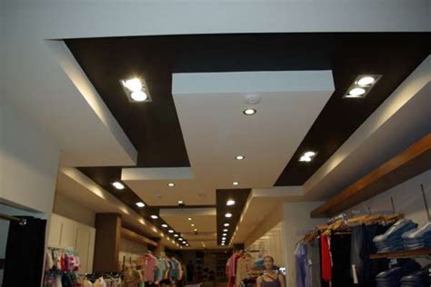 This store is outfitted with a dramatic black ceiling. Ceiling Projects - Unique Fitout Tel: 021 4822656